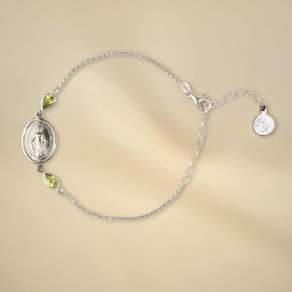 Pulsera de plata con 2 peridotos de 6 x 4 mm cada uno