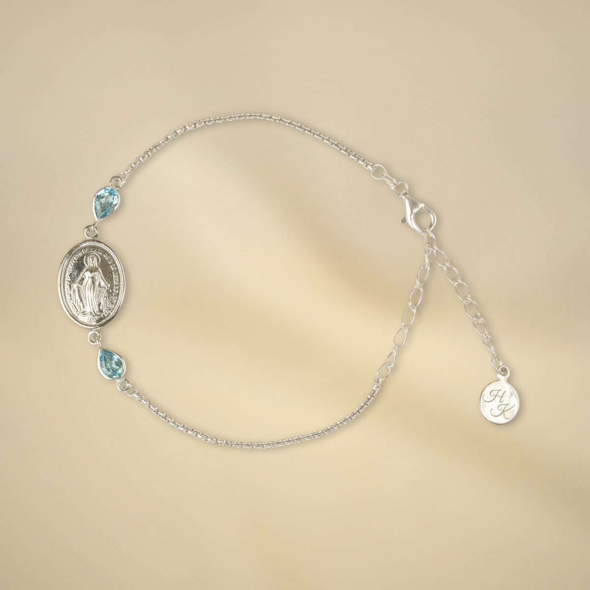 Pulsera de plata con 2 topacios Swiss Blue de 6 x 4 mm cada uno