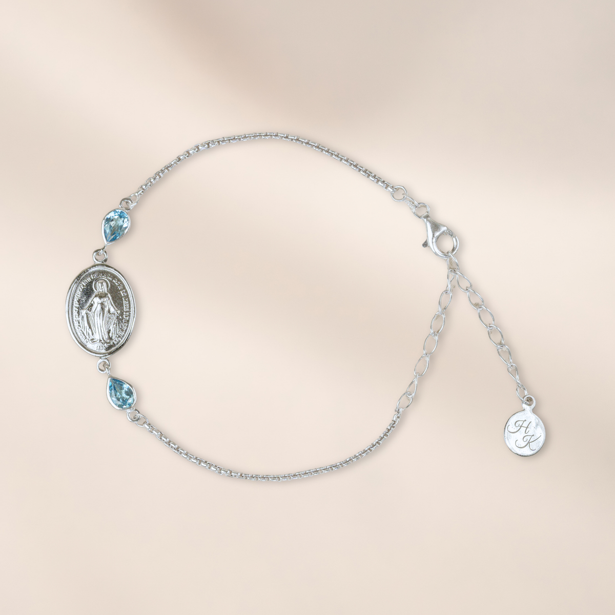 Pulsera de plata con 2 topacios Swiss Blue de 6 x 4 mm cada uno